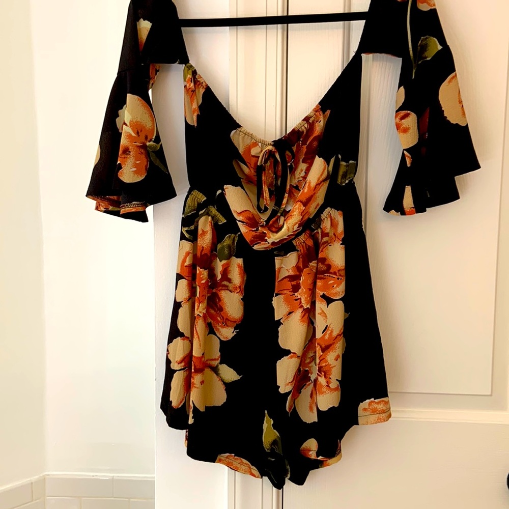 Black, burgundy, and peach Size Small romper!